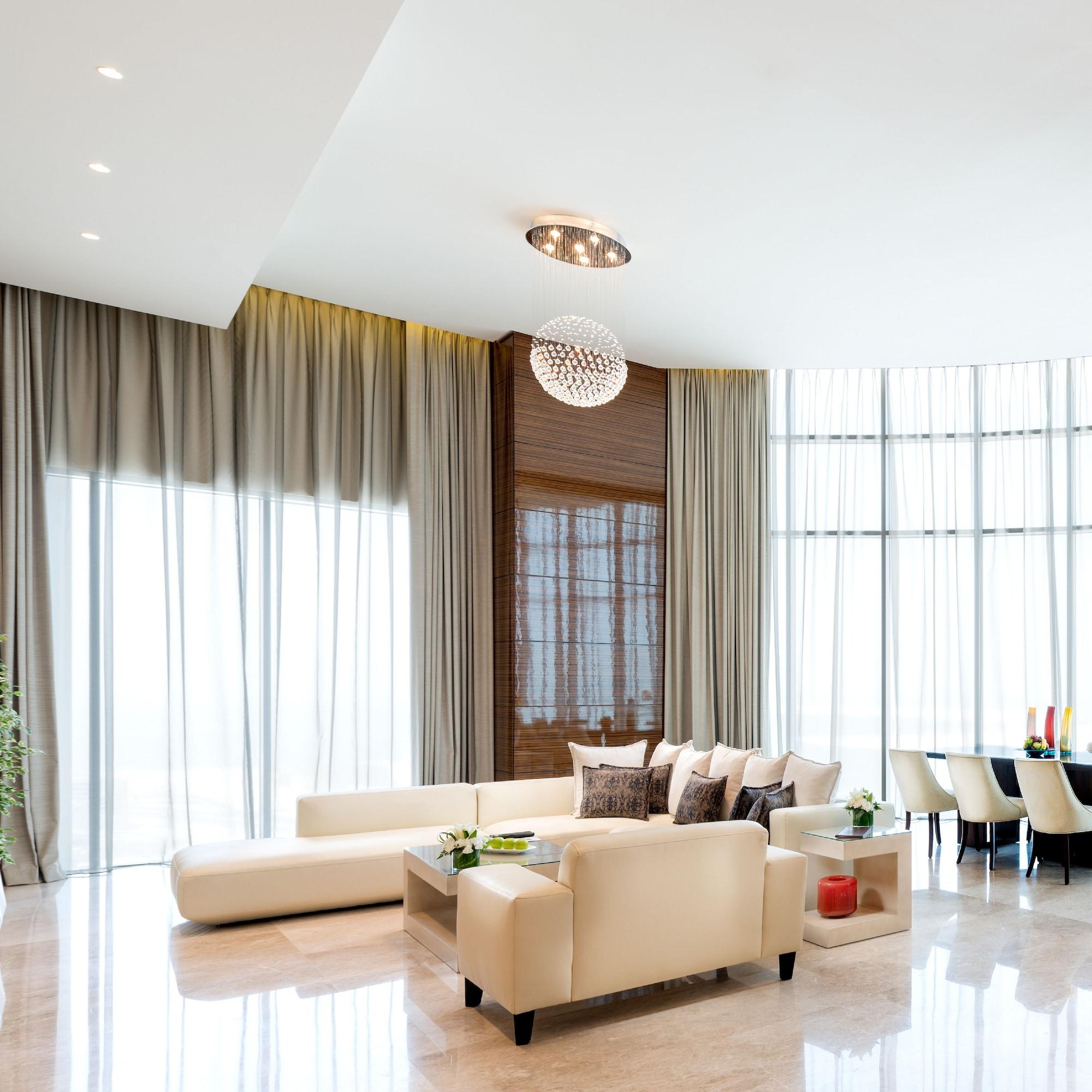 Fraser Suites Diplomatic Area Bahrain Manama Dış mekan fotoğraf A living room with curtains